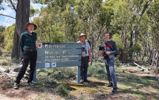 Three men stand at 'Keverstone National Park'